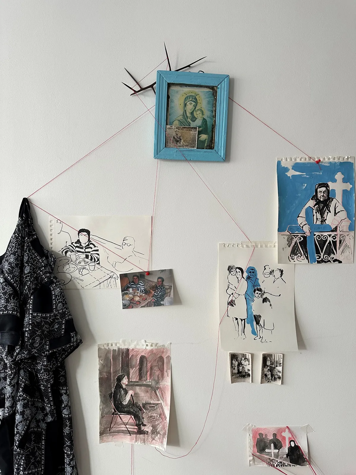 Vertical constellation of Orthodox icon, archival family photographs, and drawings connected by the red thread