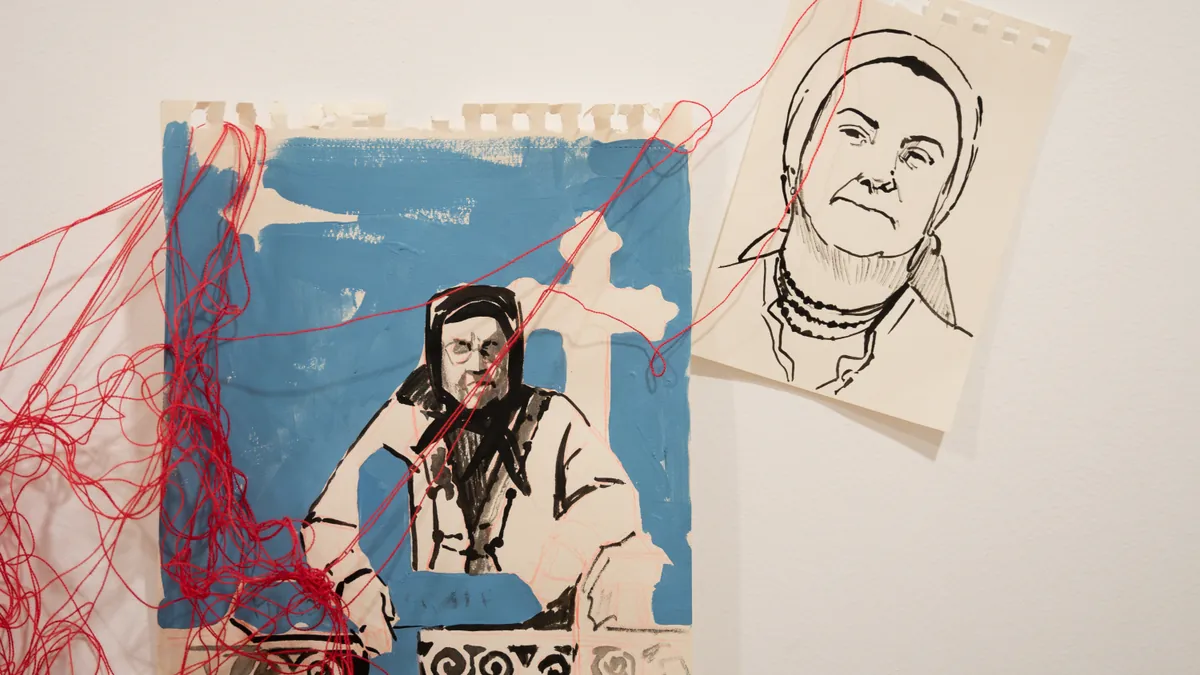 Contemporary blue and black portrait drawings of the great-grandmother traversed by red thread